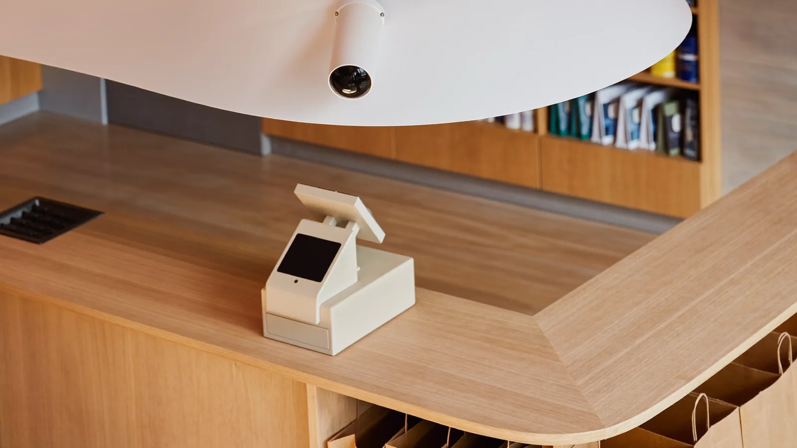 Ceiling camera aimed at a retail checkout counter